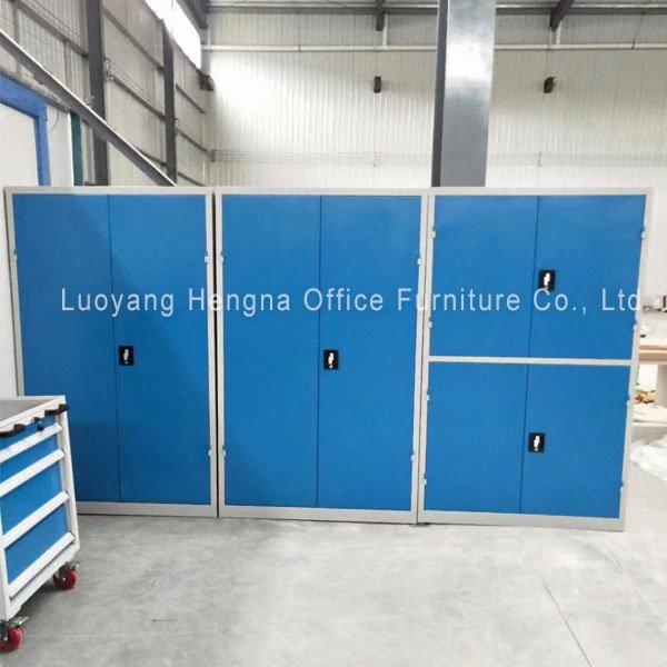Three steel tool cabinets arranged along a workshop wall for trade-based tool storage